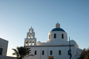 A beautiful white Orthodox Church  and a blue sky in Oia  Santorini Greece