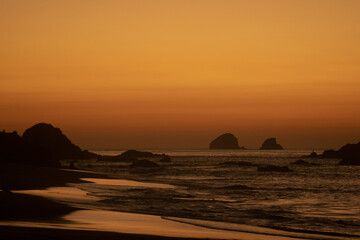 Naklejka na ściany i meble warm sunrise at the shore of the coast