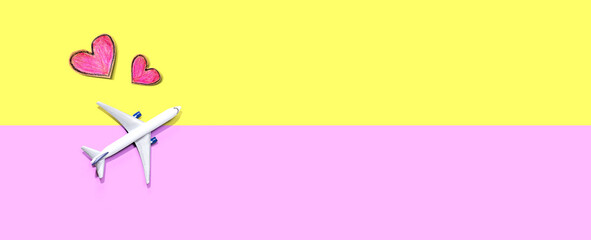 Flights booking and reservation theme with a toy airplane and hearts