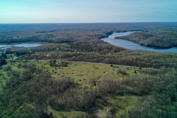 Drone shot of country fields and Country Roads in the winter