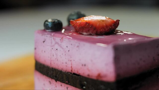 French Mousse Cake with blueberries and strawberries. Macro and slider shooting