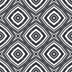 Ikat repeating swimwear design. Black