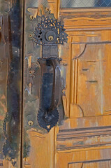 Old door with elaborate antique handle. - 510947417
