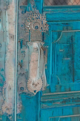Old door with elaborate antique handle. - 510947463