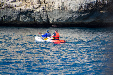 Unidentified sporters in kayak is Calanque de Port-Miou near Cassis, excursion to Calanques...