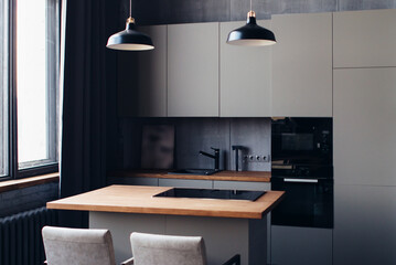 Modern kitchen interior design with furniture and table.