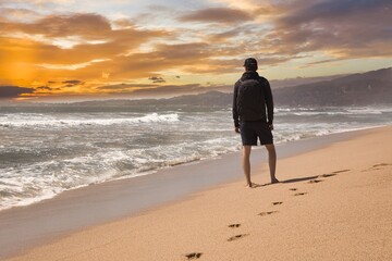 person walking on the beach