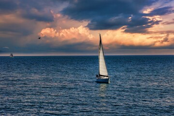 sailboat on the sea, sunset at the beach in Santa Cruz, California