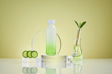 Front view of cucumber in white podium and cosmetic jar green leaf with blank space beige background 