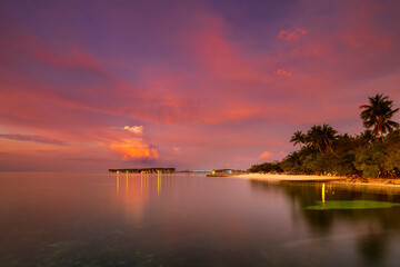 Sunset on Maldives paradise island holiday resort