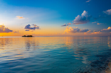 Sunset on Maldives paradise island holiday resort