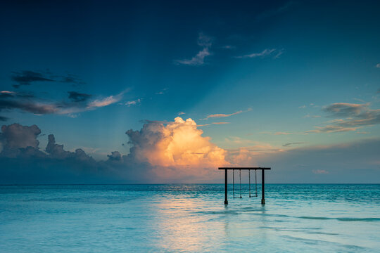 Sunset on Maldives paradise island holiday resort