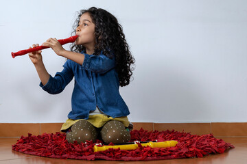 Latin American girl playing with skill the soprano recorder