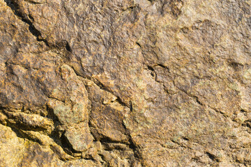 Rock plate. Colored stone surface. Wall of the house. Geology and Metamorphic rocks.
