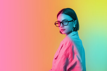 Beautiful fashionable young woman on colorful background