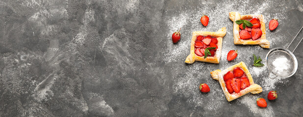 Composition with sweet strawberry puff pastries on grunge background with space for text