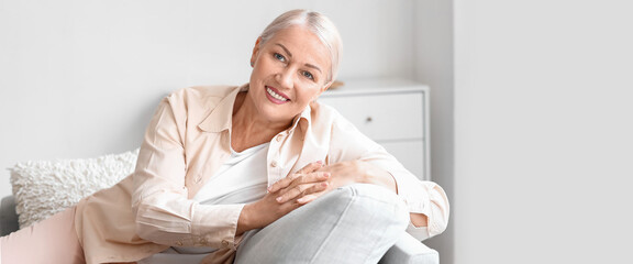 Happy mature woman at home. Concept of ageing and menopause