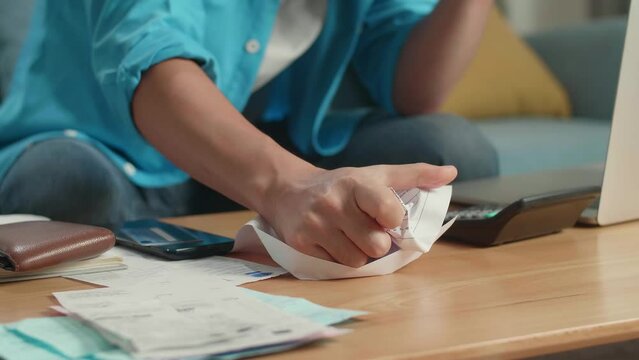 Close Up Of Man'S Hand Crumpling Paper On Table
