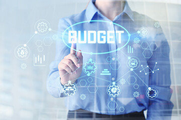Businesswoman touching word BUDGET on virtual screen against light background