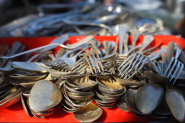 Old vintage cutlery forks and spoons at a flea market