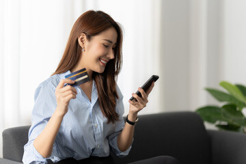 A businesswoman completes KYC using an online banking program in order to open a digital savings...