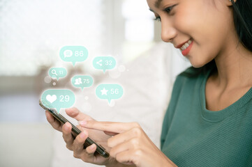 Woman hand using mobile smartphone with icon social media and social network. Online marketing concept