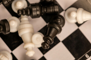Chess pieces on a chessboard. Close-up, selective focus