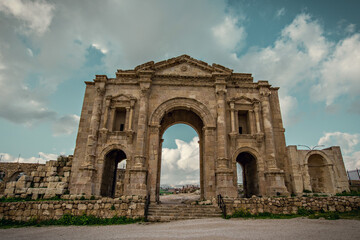 Fototapeta na wymiar Roman ruins in Jerash town in Jordan. Ancient Roman arch at Jerash town