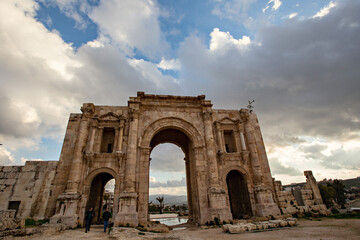 Fototapeta na wymiar Roman ruins in Jerash town in Jordan. Ancient Roman arch at Jerash town