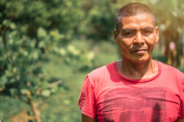 Naklejka na ściany i meble Portrait of a Latino Nicaraguan farmer man in rural Masaya, Nicaragua, photo with copy space