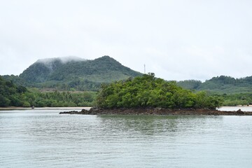 Scenic view of coast by the sea in Yao Noi Island. View from Tha Khao Pier.