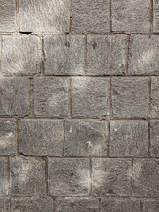 Granite cobblestoned pavement background. Stone pavement texture. Abstract background of cobblestone pavement close-up