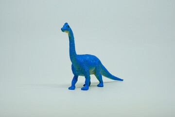 Side view of plastic Ultrasaurus dinosaur plastic toy for kids, isolated on a studio lighting background