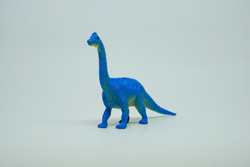 Side view of plastic Ultrasaurus dinosaur plastic toy for kids, isolated on a studio lighting...