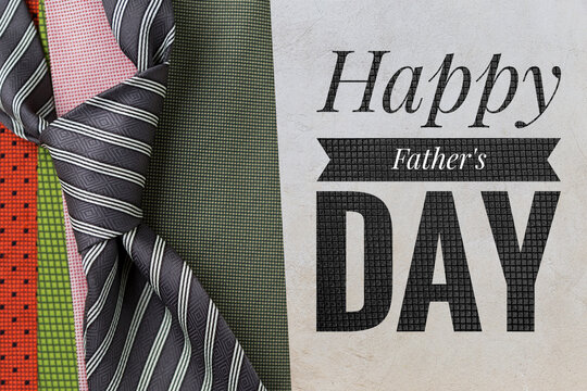 Happy Father's day banner with classic and colorful necktie on cement background, father's day greeting card idea background