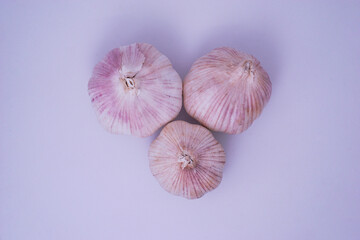 Top view fresh pink garlic group photoshoot on white studio lighting background