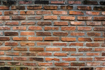 Red brick wall worn.