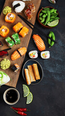 Japanese food assortment on dark background.