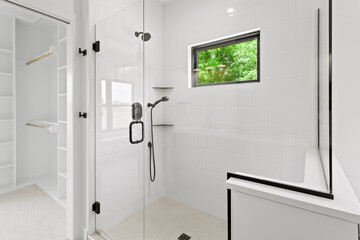 interior of bathroom with granite counter tops and mirror and walk in shower