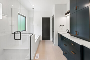 interior of bathroom with granite counter tops and mirror