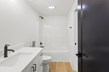 interior of bathroom with granite counter tops and mirror