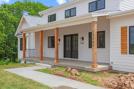Brand new construction farmhouse style white home exterior