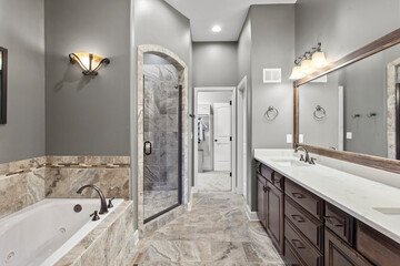 interior of bathroom with granite counter tops and mirror