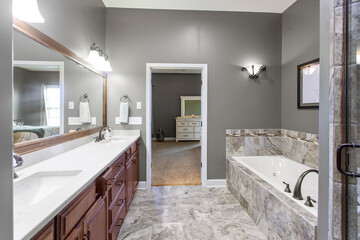 interior of bathroom with granite counter tops and mirror