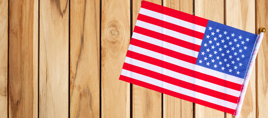 United States of America flag on wooden table background. USA holiday of Veterans, Memorial, Independence ( Fourth of July) and Labor Day concept