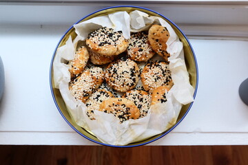 Turkish salted cookies with black sesame in box. It is called "Tuzlu Kurabiye", "Kuru Pasta", "Kandil Simidi" in Turkish. Homemade Pastry.