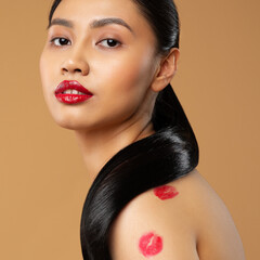 Beauty Model Face with Red Lips Makeup. Lipstick Kiss Marks over Woman Body Skin. Sexy Fashion...