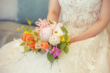 Bride holding bouquet.