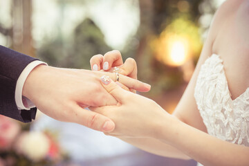 Bride Put on Wedding Ring Groom Hand