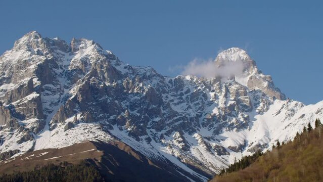 Beautiful landscape with snowy mountains in nature reserve. Majestic mountain at travel destination. Travel around the world